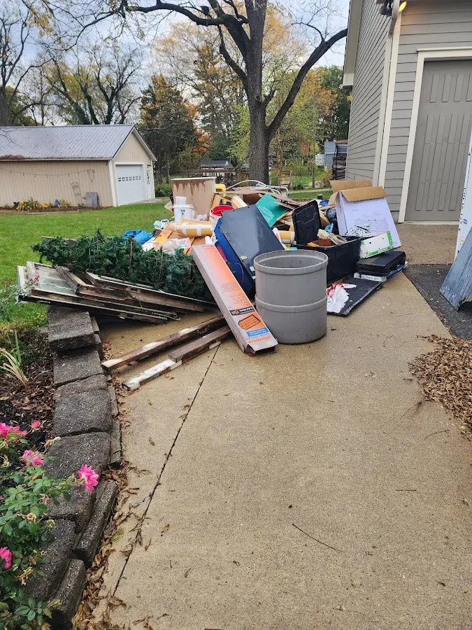 Dumpster being loaded with debris for 3 Yard Dumpster Rental in Clare